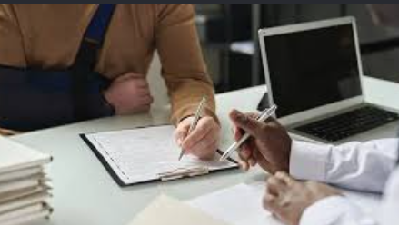 Client signing documents for a personal injury case