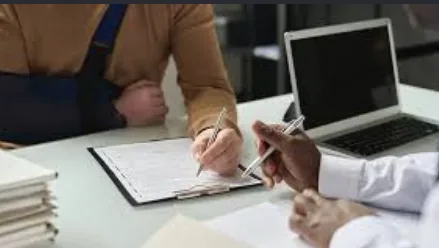 Client signing documents for a personal injury case