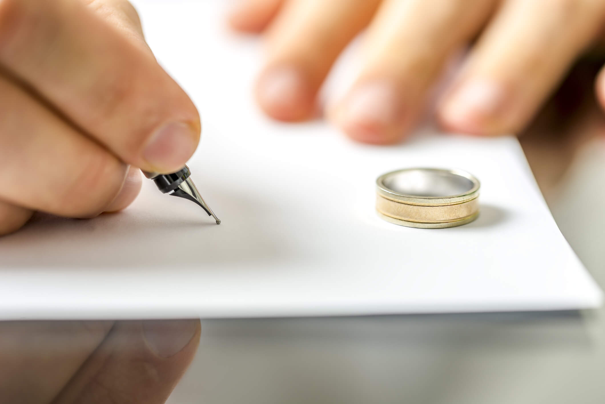 A customer signing a divorce document after the waiting period in Las Vegas, Nevada at Donn W Prokopius Chtd Law Office