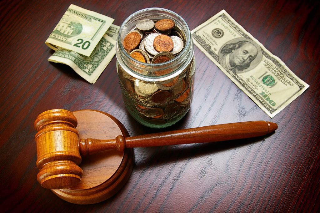 Professional legal team at PRO LAW GROUP discussing asset valuation and property division strategies for a client in Las Vegas Nevada.